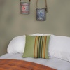 image:imagePrimitives by Kathy Pillow with Decorative Cover from Our Lake amp Cabin Collection displaying a Rustic Green Brown and Orange Stripe Pattern on the Front Inspired by Vintage Cabin Home dcorStriped Green