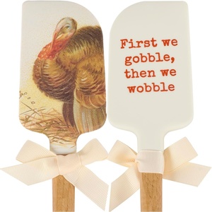image:imagePrimitives by Kathy doublesided silicone novelty cooking spatulaFall amp Harvest Collectionvintage art of a turkey on frontfun holiday pun on back that reads First We Gobble Then We Wobble